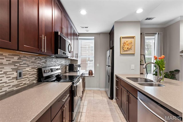 4260 Lindell Blvd Unit B, Saint Louis, MO 63108 - kitchen featuring appliances with stainless steel finishes, a sink, tasteful backsplash, baseboards, and recessed lighting
