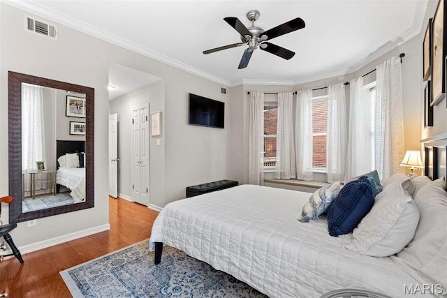 4260 Lindell Blvd Unit B, Saint Louis, MO 63108 - bedroom featuring multiple windows, wood finished floors, ornamental molding, baseboards, and ceiling fan