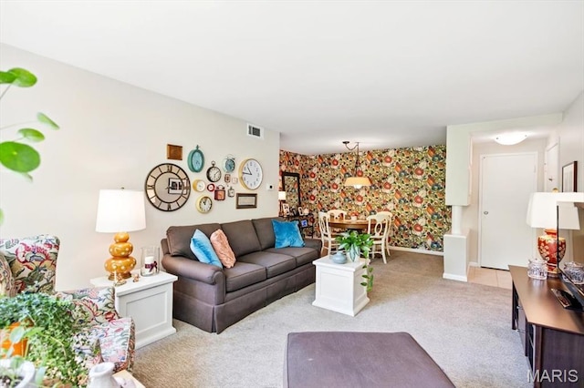 5 Delcrest Ct Unit 203, Saint Louis, MO 63124 - living area featuring wallpapered walls, light carpet, baseboards, and an accent wall