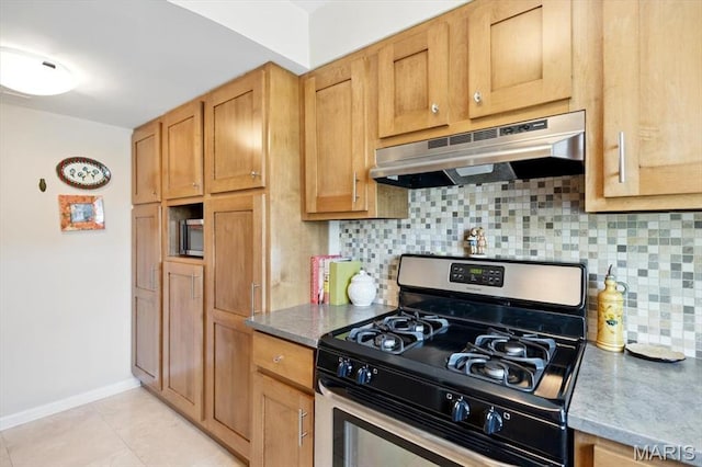 5 Delcrest Ct Unit 203, Saint Louis, MO 63124 - kitchen with gas stove, under cabinet range hood, tasteful backsplash, light tile patterned floors, and baseboards