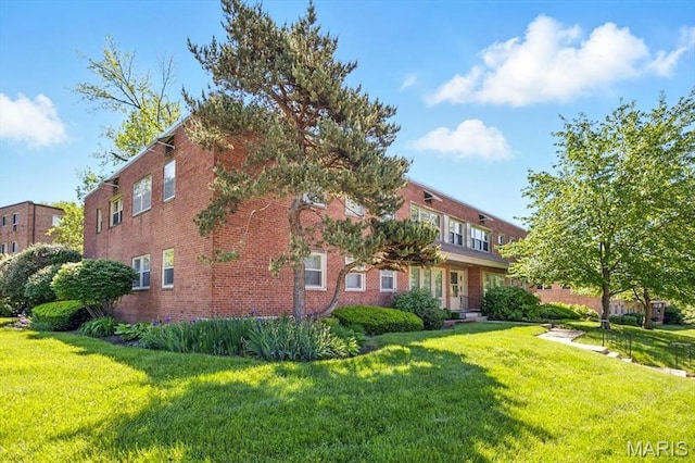 5 Delcrest Ct Unit 203, Saint Louis, MO 63124 - view of side of property featuring a yard and brick siding