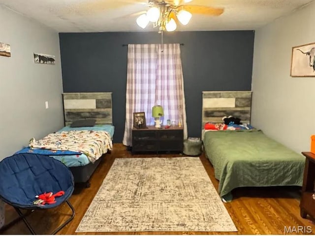 23784 Maries Road 410th Rd, Belle, MO 65013 - bedroom featuring wood finished floors and a ceiling fan