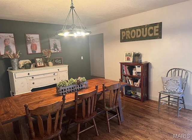 23784 Maries Road 410th Rd, Belle, MO 65013 - dining area featuring dark wood-style floors, a chandelier, and baseboards