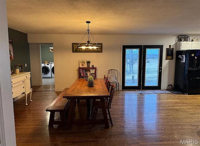 23784 Maries Road 410th Rd, Belle, MO 65013 - dining space with wood finished floors, independent washer and dryer, a textured ceiling, a chandelier, and baseboards