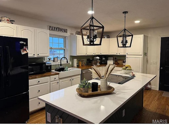 23784 Maries Road 410th Rd, Belle, MO 65013 - kitchen featuring black appliances, dark wood-style flooring, white cabinetry, a sink, and recessed lighting