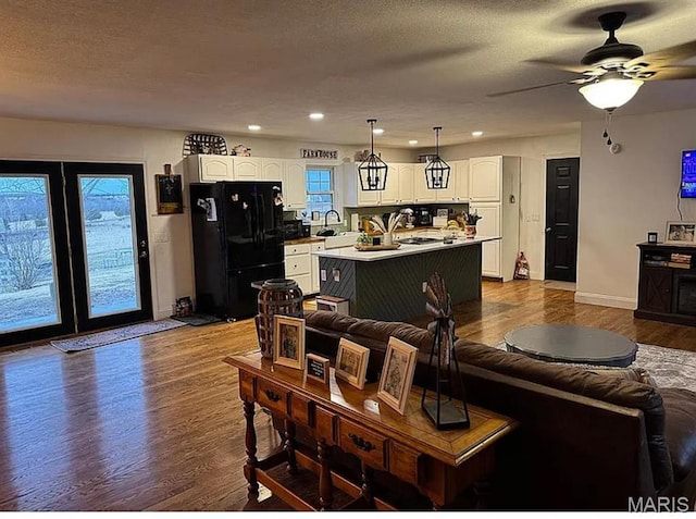 23784 Maries Road 410th Rd, Belle, MO 65013 - living area with baseboards, dark wood-type flooring, a ceiling fan, recessed lighting, and a textured ceiling