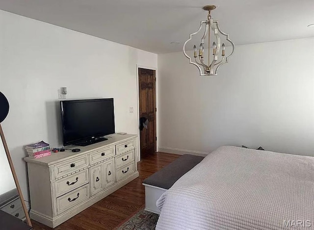 23784 Maries Road 410th Rd, Belle, MO 65013 - bedroom featuring dark wood-style flooring, a chandelier, and baseboards