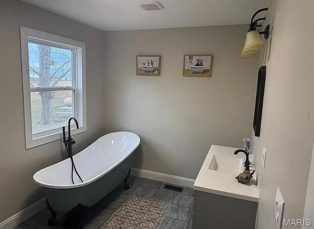 23784 Maries Road 410th Rd, Belle, MO 65013 - full bath with baseboards, double vanity, and a freestanding tub