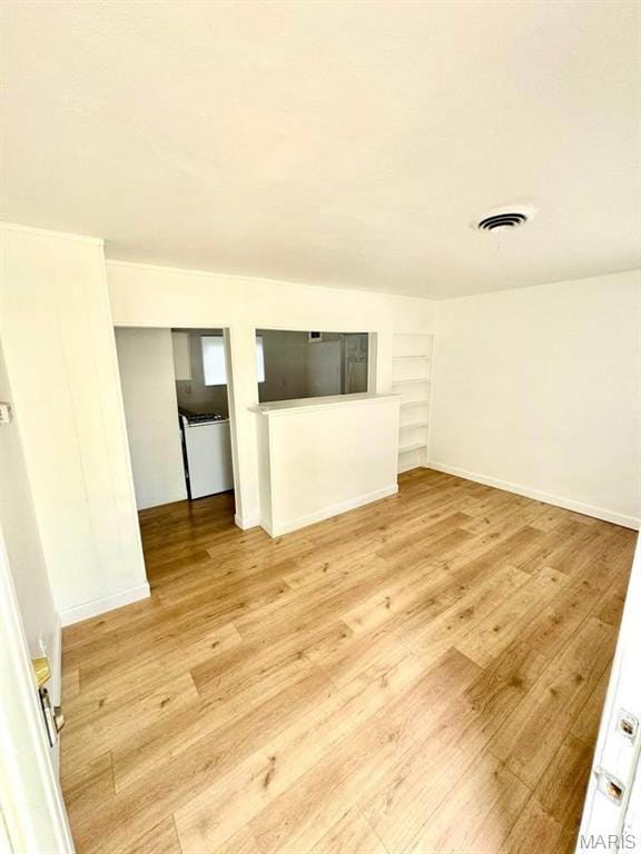 10117 Duke Dr, Saint Louis, MO 63136 - unfurnished room with light wood-type flooring and baseboards