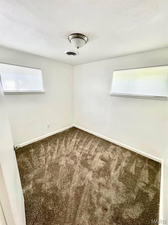 10117 Duke Dr, Saint Louis, MO 63136 - carpeted empty room with baseboards and healthy amount of natural light
