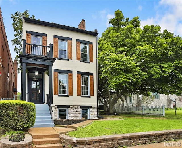 6504 Michigan Ave, Saint Louis, MO 63111 - view of front of house with a balcony and a chimney