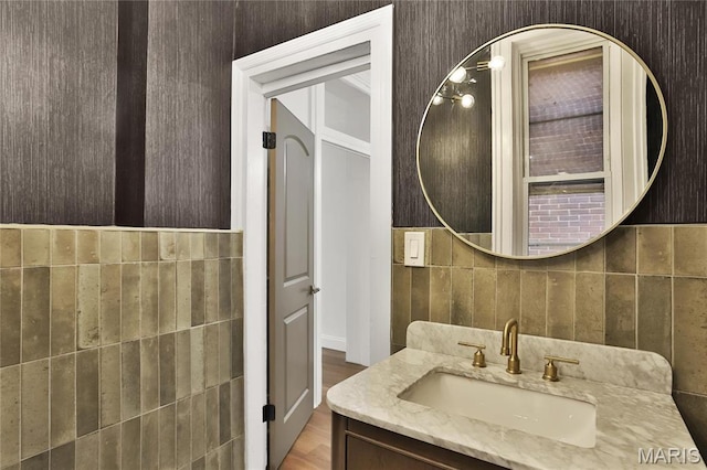 6504 Michigan Ave, Saint Louis, MO 63111 - bathroom with vanity, tile walls, and wood finished floors