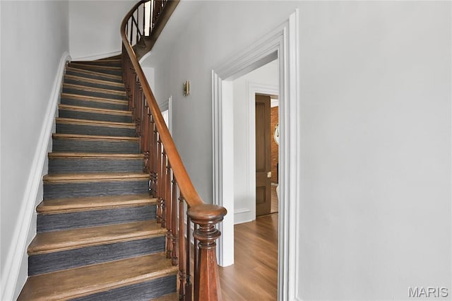 6504 Michigan Ave, Saint Louis, MO 63111 - stairway with wood finished floors and baseboards