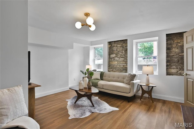 6504 Michigan Ave, Saint Louis, MO 63111 - living area featuring wood finished floors, baseboards, and a chandelier