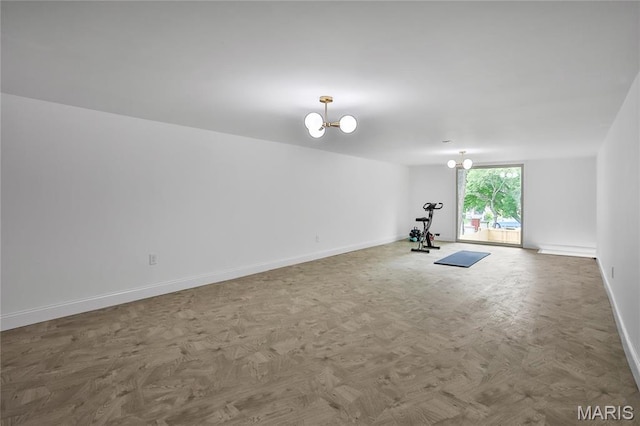 6504 Michigan Ave, Saint Louis, MO 63111 - workout room featuring baseboards and a chandelier