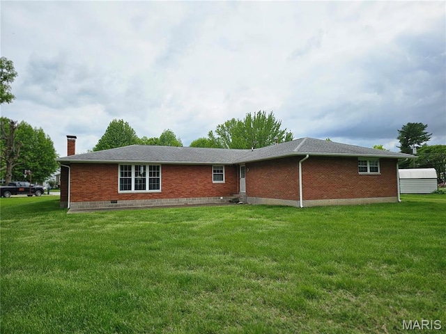 1117 Meadow Ln, Sparta, IL 62286 - rear view of property with brick siding, a yard, and a chimney