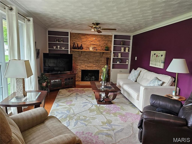 1117 Meadow Ln, Sparta, IL 62286 - living area featuring healthy amount of natural light, a ceiling fan, wood finished floors, built in features, and ornamental molding