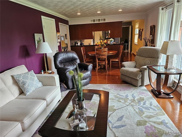 1117 Meadow Ln, Sparta, IL 62286 - living area featuring wood finished floors, recessed lighting, and crown molding