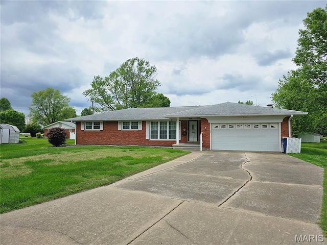 1117 Meadow Ln, Sparta, IL 62286 - ranch-style home with brick siding, driveway, a garage, and a front yard