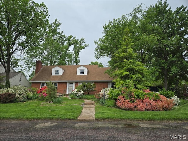 369 Halcyon Dr, Saint Louis, MO 63122 - new england style home with a chimney, a front lawn, and brick siding