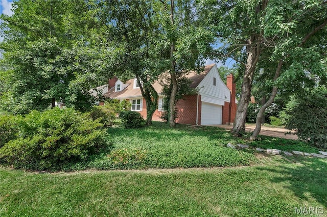 369 Halcyon Dr, Saint Louis, MO 63122 - view of home's exterior featuring brick siding, a lawn, and an attached garage