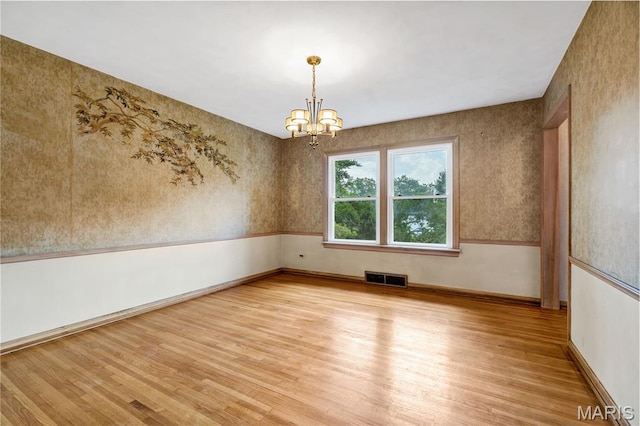 369 Halcyon Dr, Saint Louis, MO 63122 - spare room featuring light wood finished floors, a chandelier, and wallpapered walls