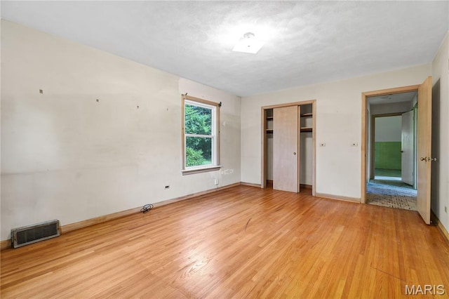 369 Halcyon Dr, Saint Louis, MO 63122 - unfurnished bedroom featuring light wood-style flooring and a closet