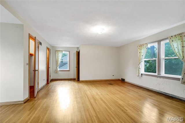 369 Halcyon Dr, Saint Louis, MO 63122 - empty room featuring light wood-style flooring and healthy amount of natural light