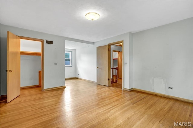 369 Halcyon Dr, Saint Louis, MO 63122 - unfurnished bedroom with light wood-style floors and baseboards