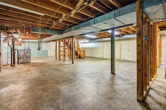369 Halcyon Dr, Saint Louis, MO 63122 - unfinished basement featuring a heating unit and stairs