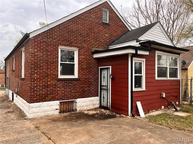 6604 Donald St, Saint Louis, MO 63121 - back of house with a patio and brick siding