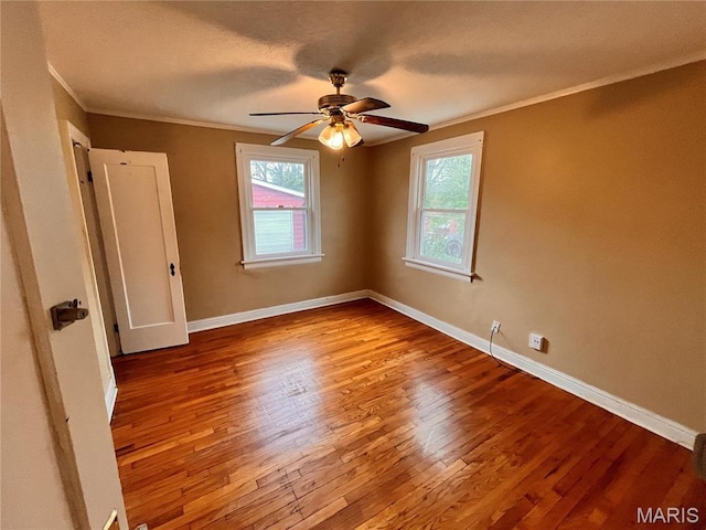 6604 Donald St, Saint Louis, MO 63121 - empty room with wood finished floors, a ceiling fan, and crown molding