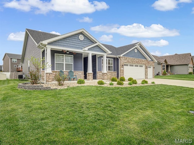 craftsman house featuring a porch, driveway, a garage, ceiling fan, and stone siding