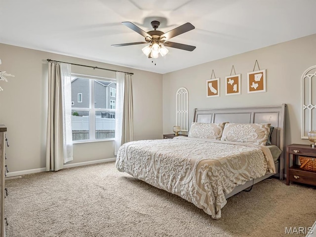 bedroom featuring carpet flooring, baseboards, and a ceiling fan