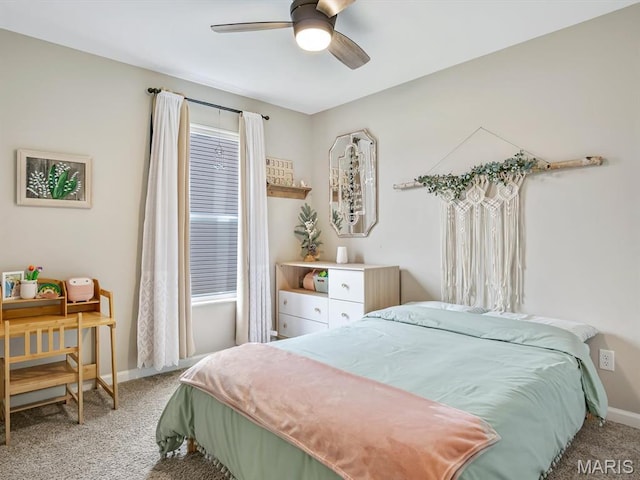 bedroom featuring light carpet, baseboards, and ceiling fan