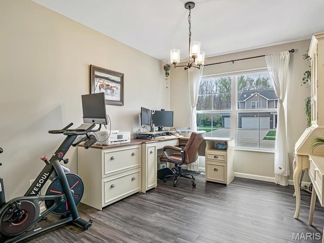 office with dark wood-style floors, a chandelier, and baseboards