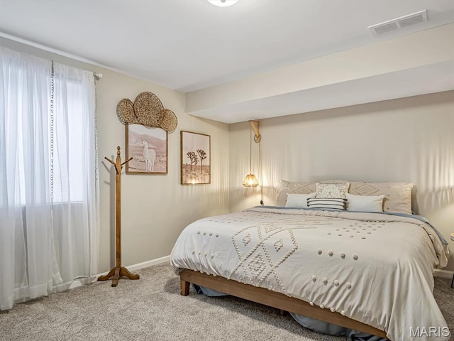bedroom with carpet and baseboards