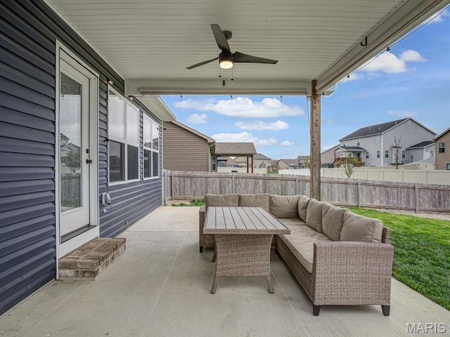 view of patio with an outdoor hangout area, a residential view, a fenced backyard, and a ceiling fan