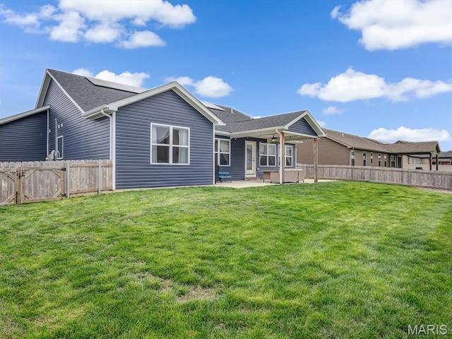 back of house with a patio and a ceiling fan