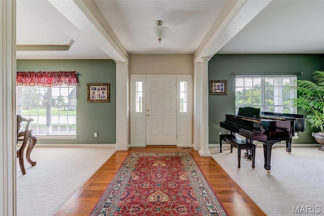 41 Deer Creek Dr, Ofallon, MO 63366 - carpeted entrance foyer with ornate columns, healthy amount of natural light, baseboards, and wood finished floors