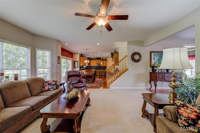 41 Deer Creek Dr, Ofallon, MO 63366 - living area featuring light carpet, stairway, ceiling fan, baseboards, and recessed lighting