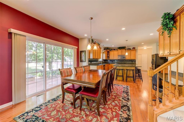 41 Deer Creek Dr, Ofallon, MO 63366 - dining room featuring light wood-style floors, stairway, and recessed lighting