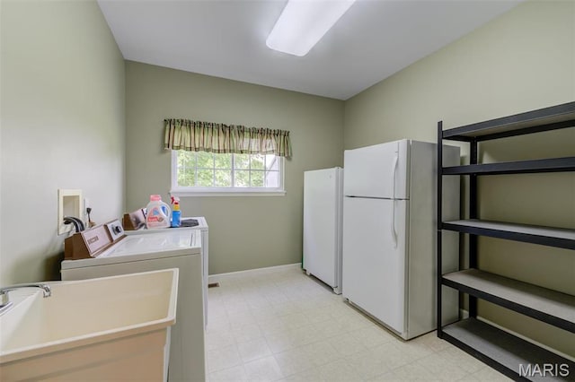 41 Deer Creek Dr, Ofallon, MO 63366 - laundry room featuring washer and clothes dryer, light flooring, and baseboards