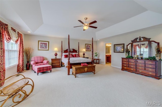 41 Deer Creek Dr, Ofallon, MO 63366 - carpeted bedroom with a raised ceiling, vaulted ceiling, connected bathroom, a ceiling fan, and baseboards