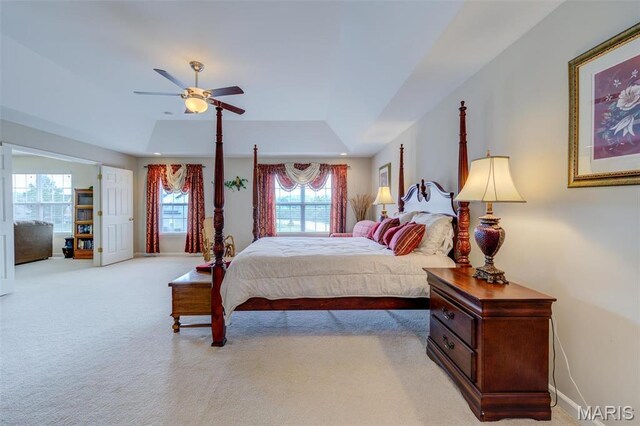 41 Deer Creek Dr, Ofallon, MO 63366 - bedroom featuring a raised ceiling, light colored carpet, baseboards, and a ceiling fan