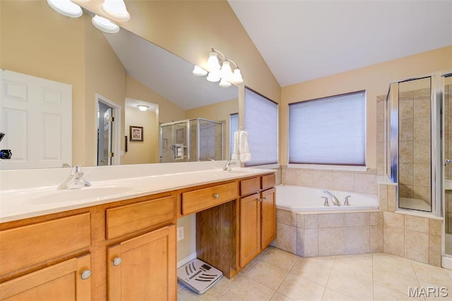 41 Deer Creek Dr, Ofallon, MO 63366 - bathroom featuring lofted ceiling, a shower stall, tile patterned flooring, a bath, and double vanity