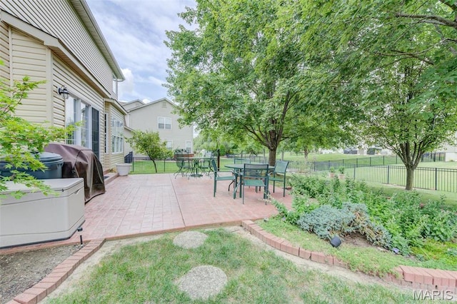 41 Deer Creek Dr, Ofallon, MO 63366 - view of patio with area for grilling, a fenced backyard, and outdoor dining space