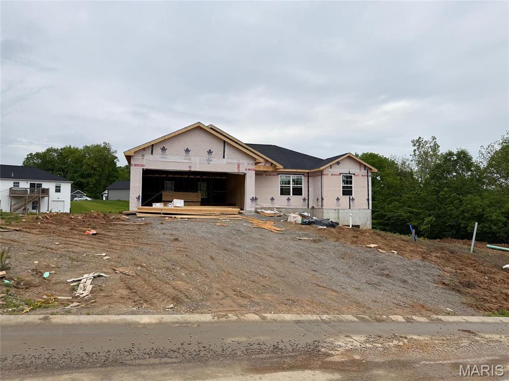582 Wentworth Dr, Jackson, MO 63755 - property under construction featuring an attached garage and driveway