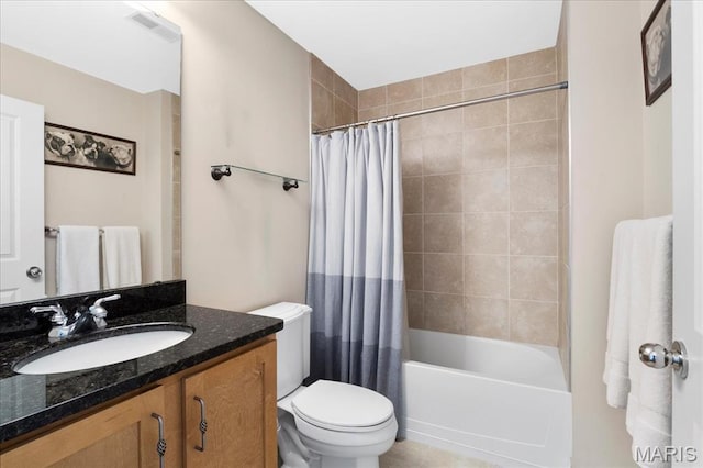 full bathroom with toilet, vanity, and shower / tub combo with curtain
