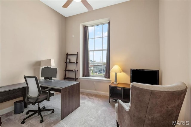 home office featuring baseboards, carpet floors, and a ceiling fan